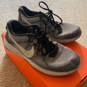 Grey Nike running shoes